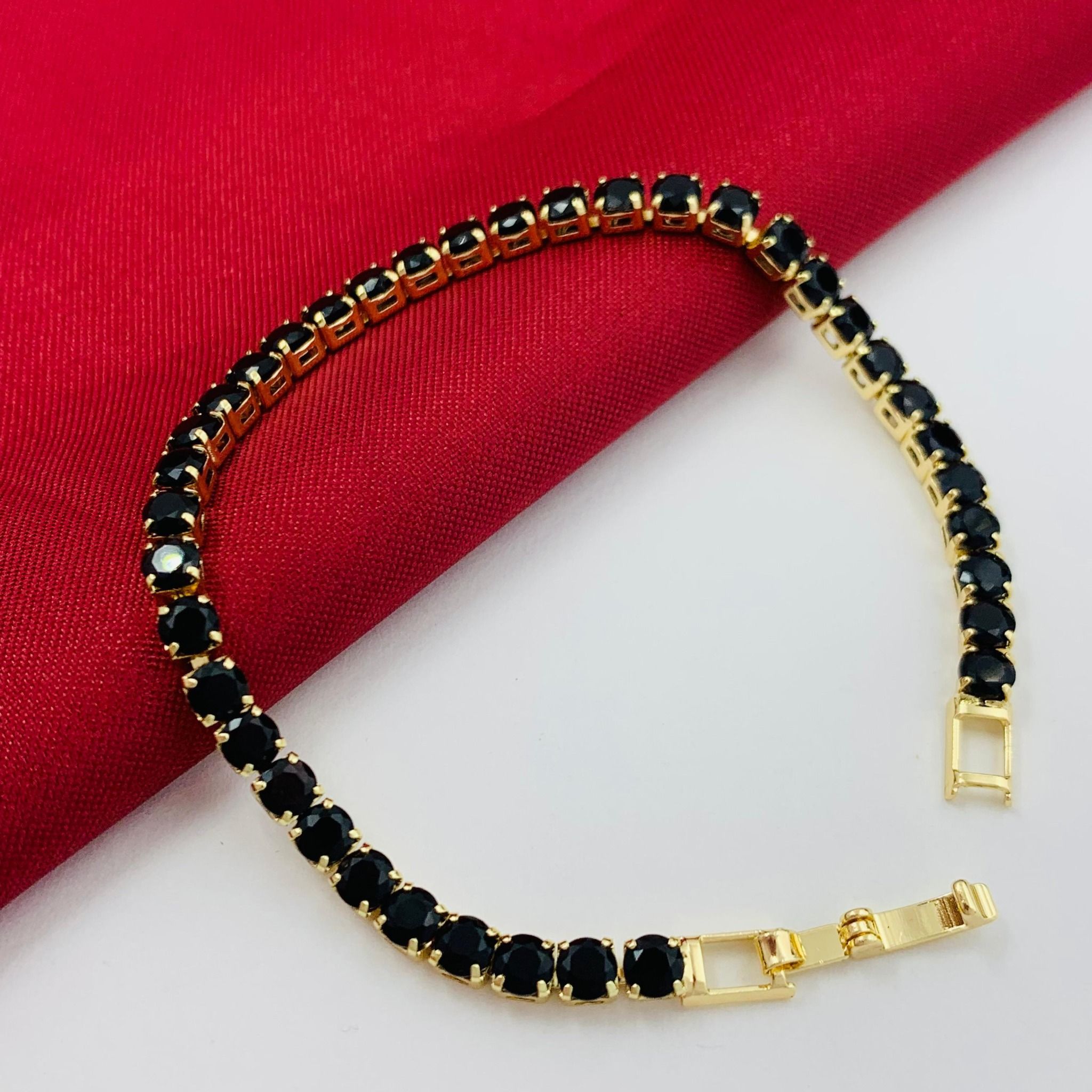 PULSERA EN RODIO CON GEMAS NEGRAS